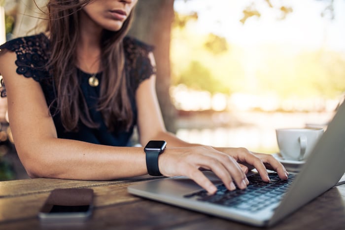 Woman typing on laptop