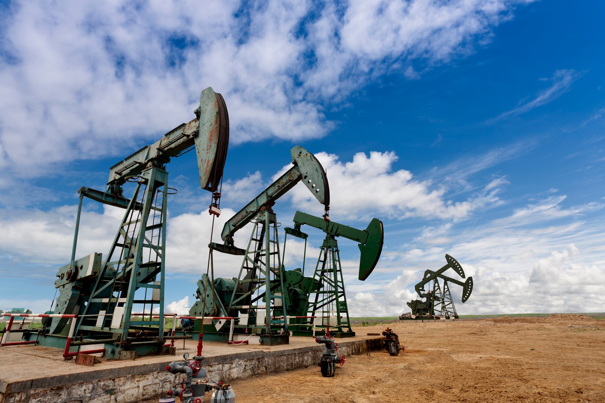 Several oil pumps in a field.