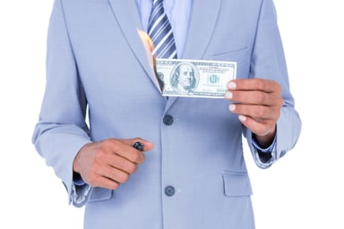 BUsiness man setting fire to money