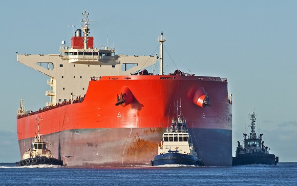 Red dry bulk ship at sea