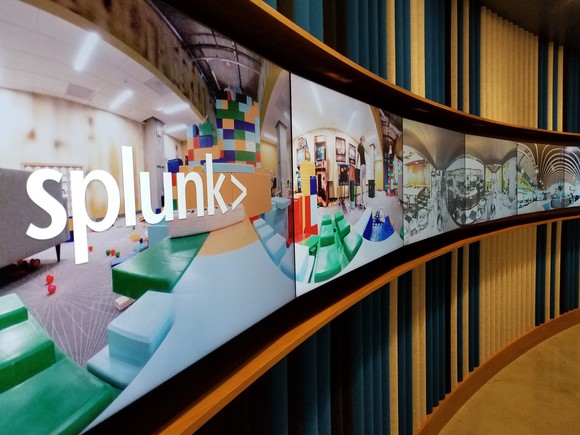 Splunk logo displayed at headquarters office on an array of flat-screen TVs.