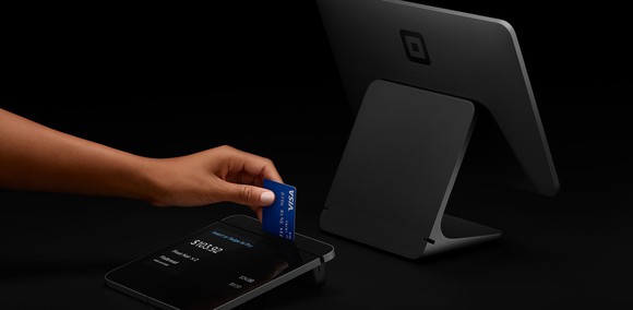 Customer using Square's mobile payment solutions