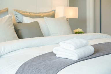 Hotel Room with Towels on Bed