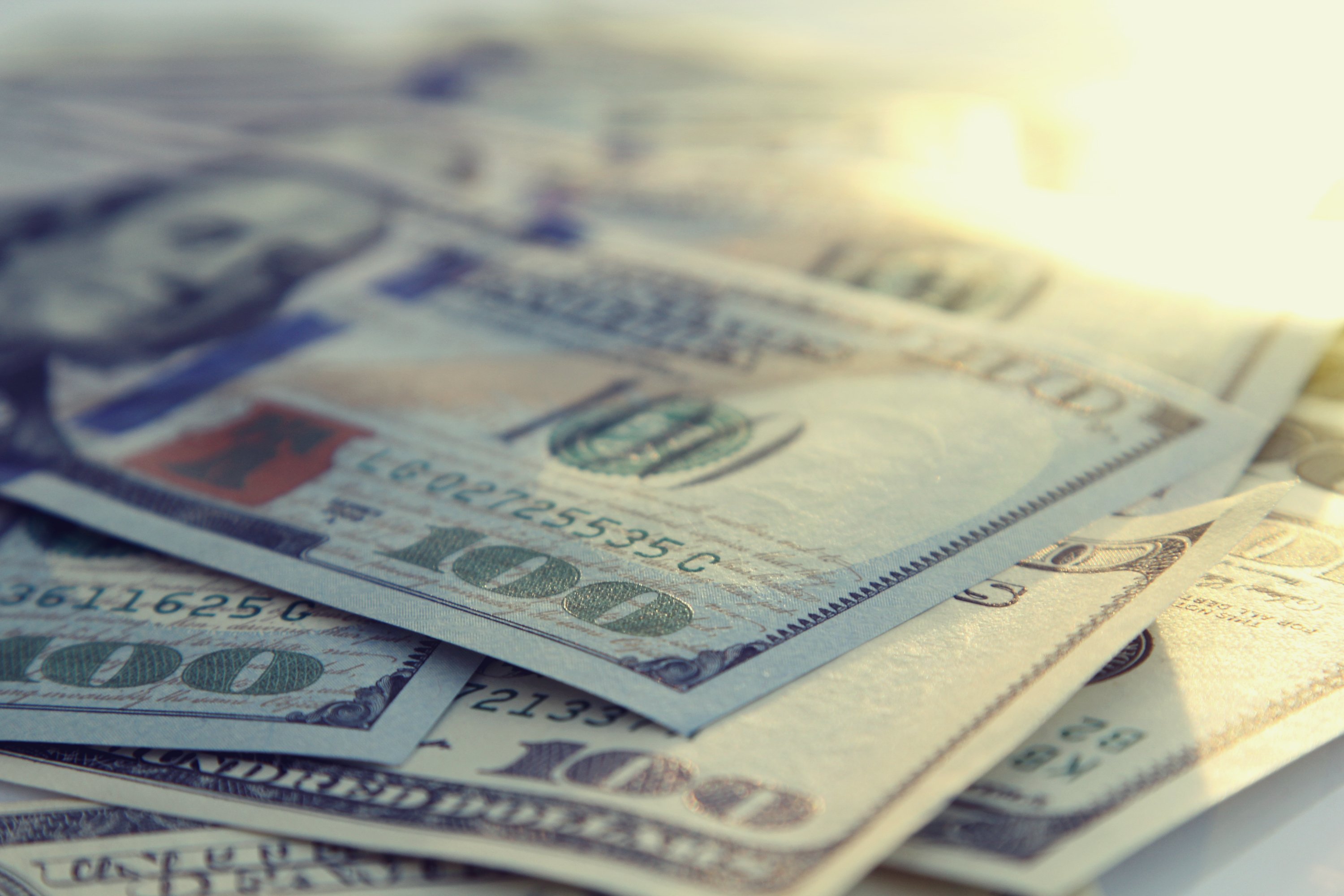 A stack of $100 bills, seen close up