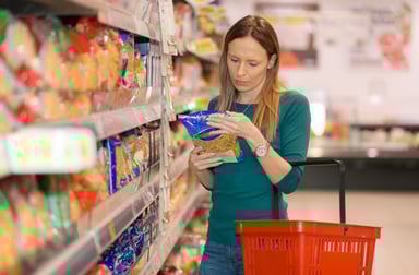 Woman Buying Pasta in Dollar Store