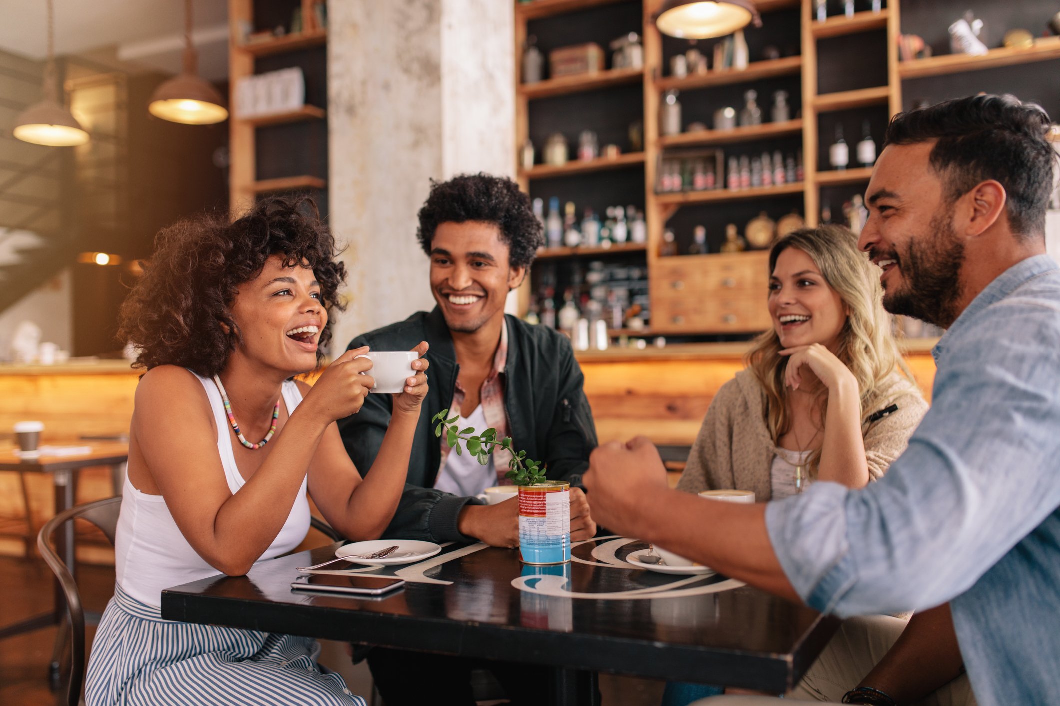 A group of people hanging out in a coffee shop