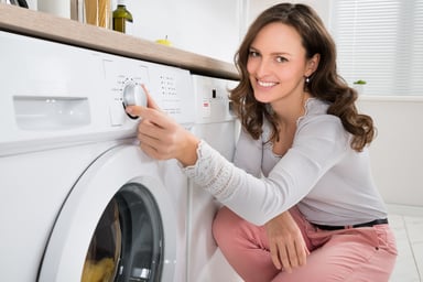 woman using washer