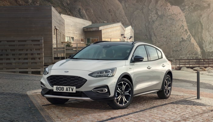 A white 2019 Ford Focus Active with British license plates. 