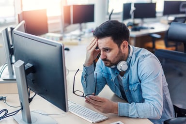 man at computer frowning_GettyImages-939098356