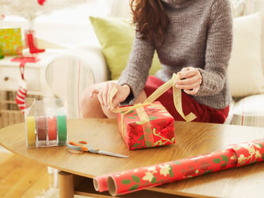 woman wrapping presents_GettyImages-467580247