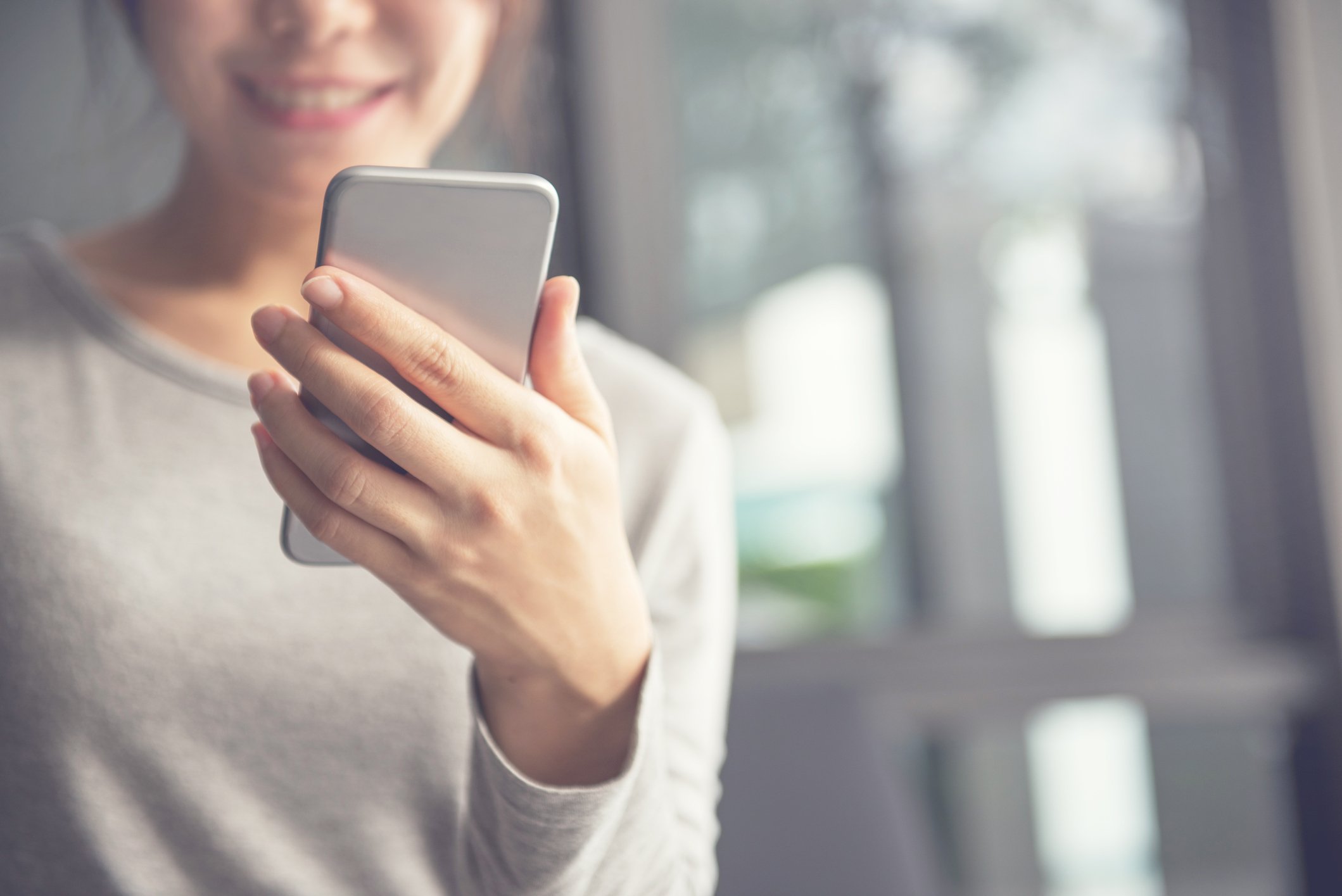 Woman looking at her smartphone