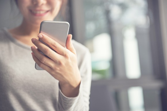 Woman looking at her smartphone