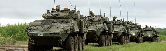 A convoy of LAV 6 armored vehicles on the move.