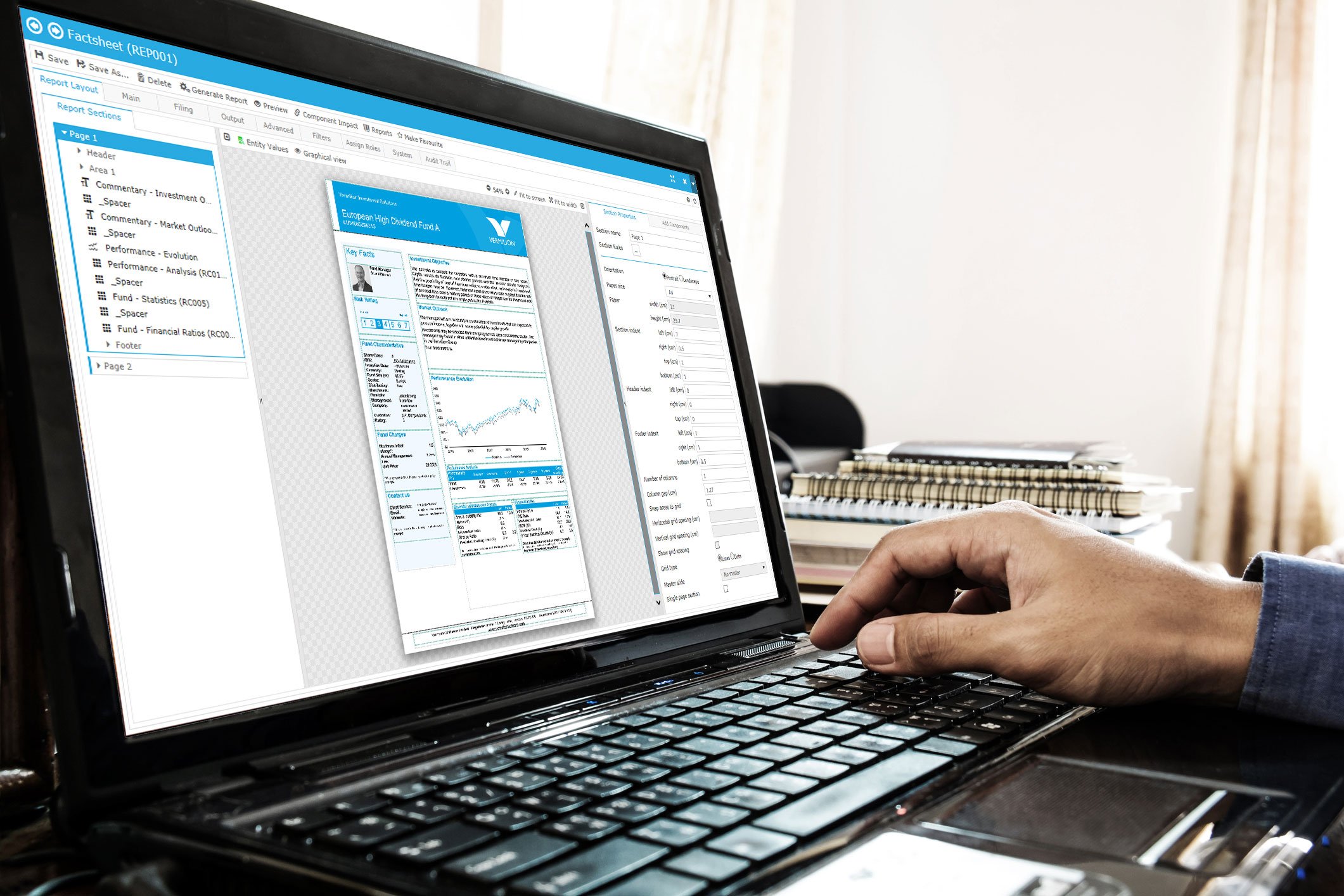 Hand on computer keyboard in front of monitor showing various information.