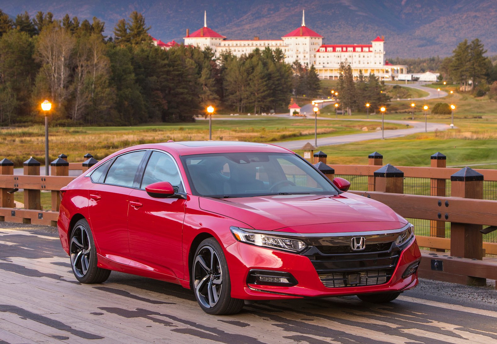 A red Honda Accord Sport, a midsize sedan.