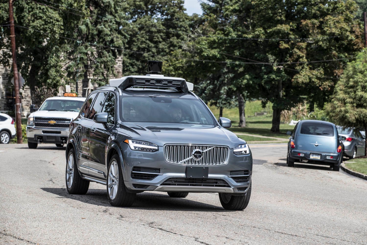 A self-driving Uber SUV on the road.