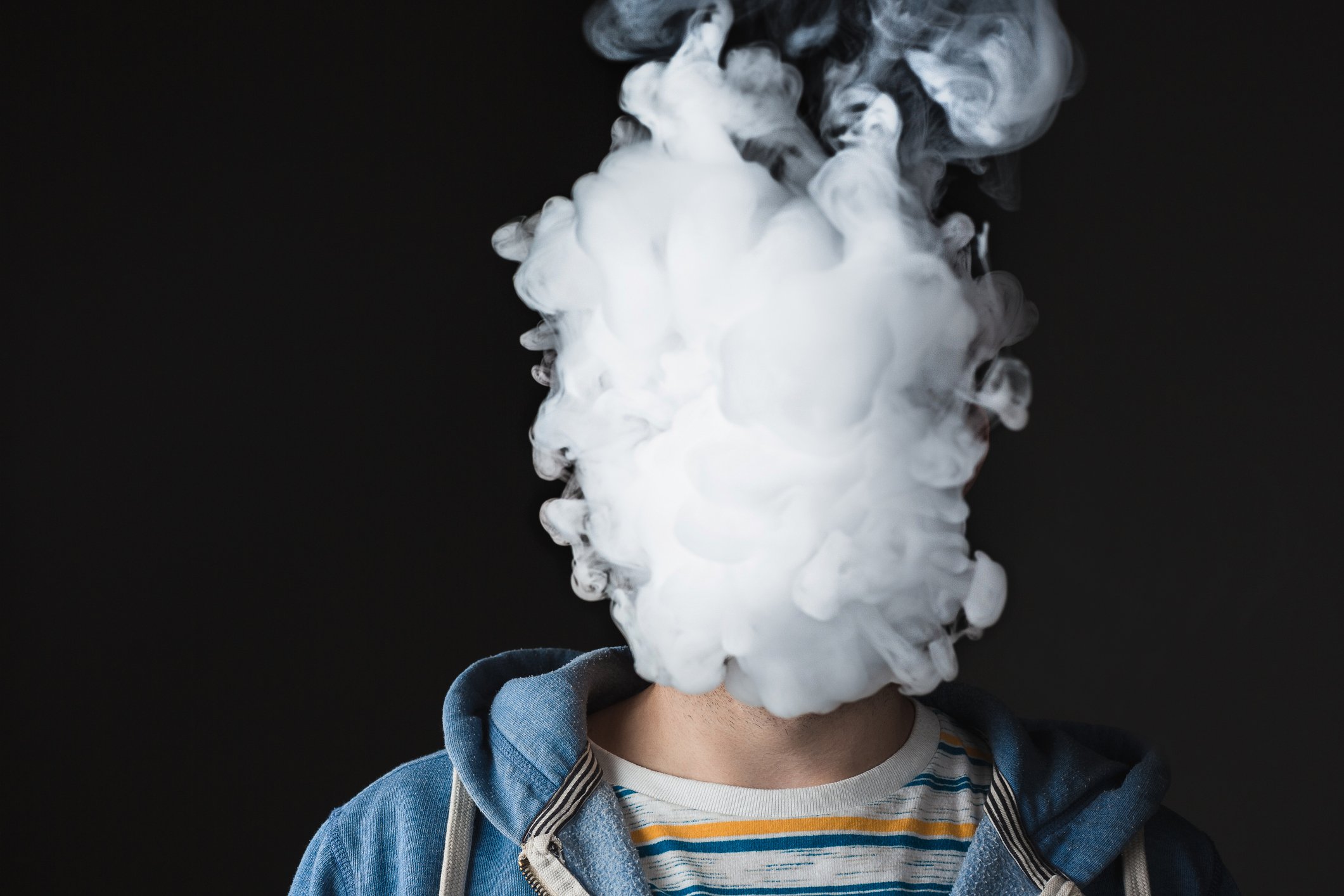 Cloud of vapor obscuring a face
