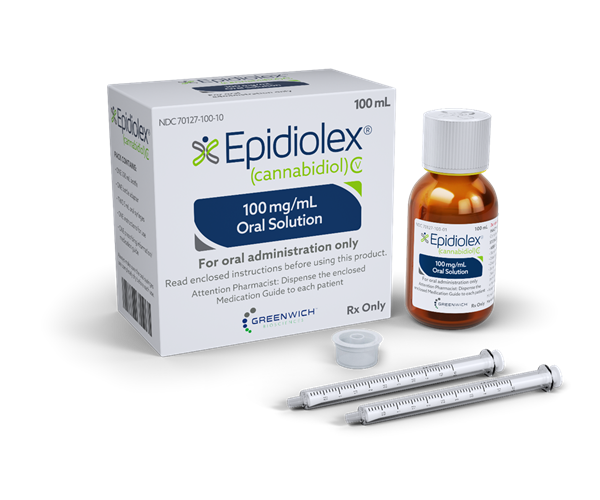 A bottle of Epidiolex, next to its packaging and two droppers. 