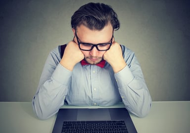 man frowning at laptop_GettyImages-924918928