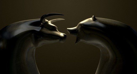 Bull and bear in marble squaring off against one another.