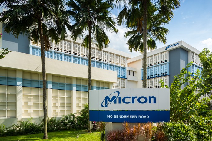 Micron logo on a sign in front of an office building.