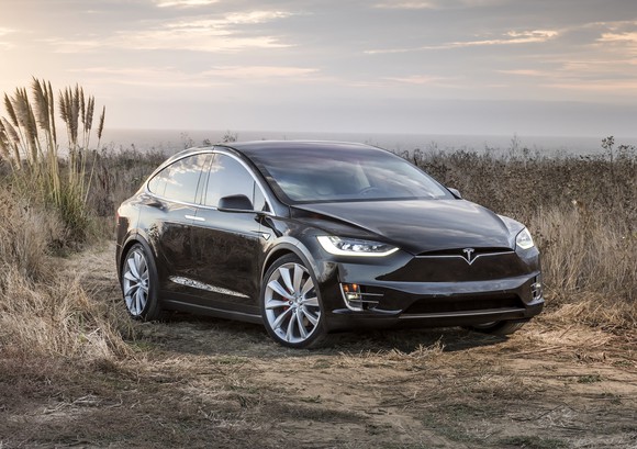 A black Tesla Model X, a 7-passenger luxury SUV.