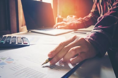 Man at computer working on business document