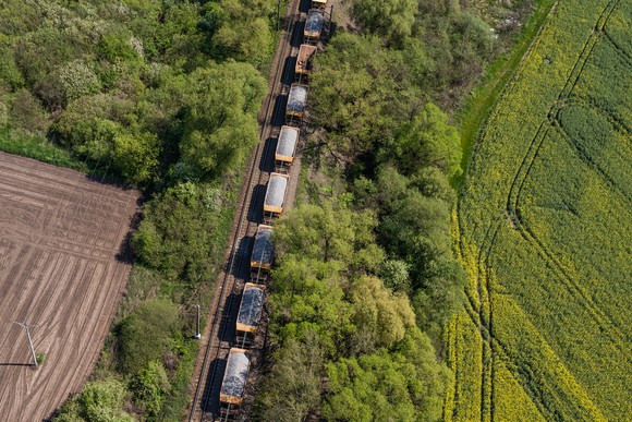 Aerial view of cargo train on track.