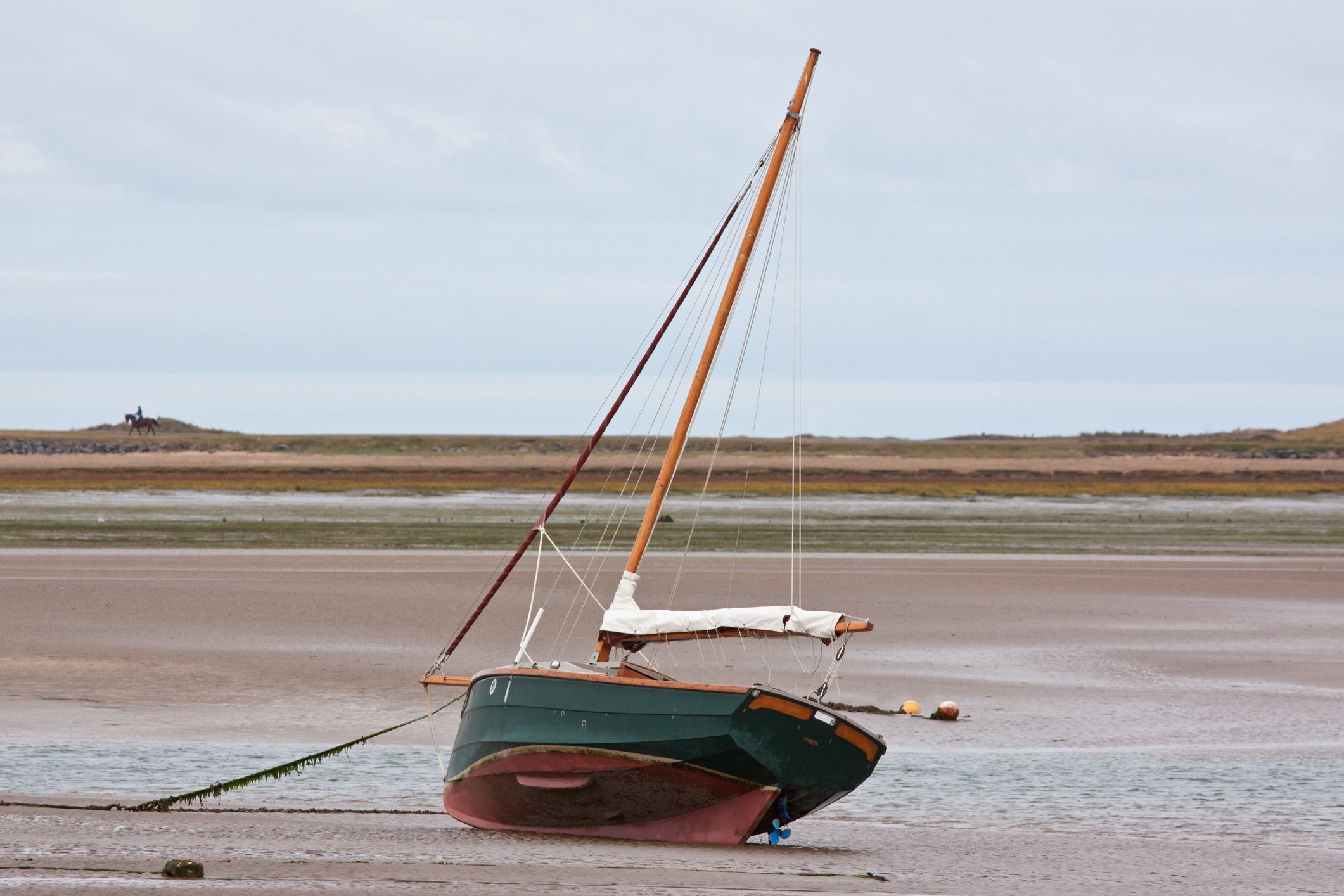 Sailboat beached by ebb tide.