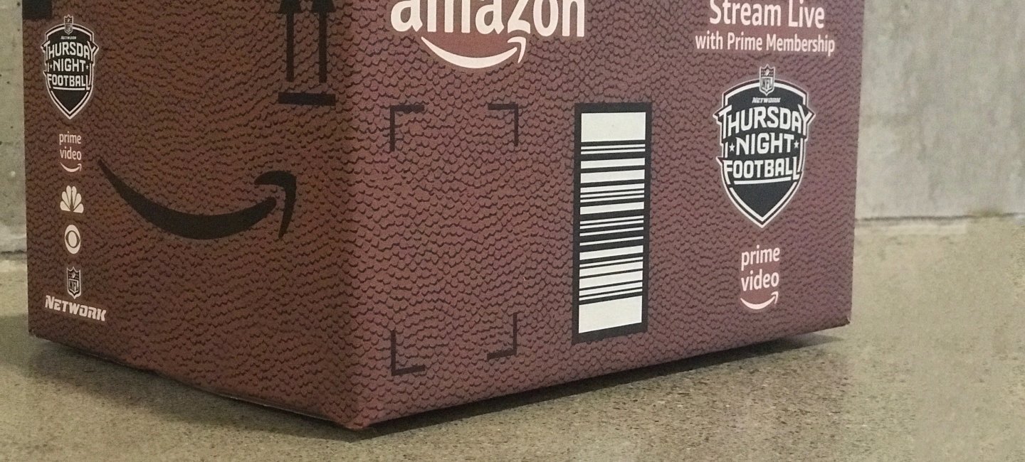 An Amazon box designed like a football promoting Thursday Night Football.