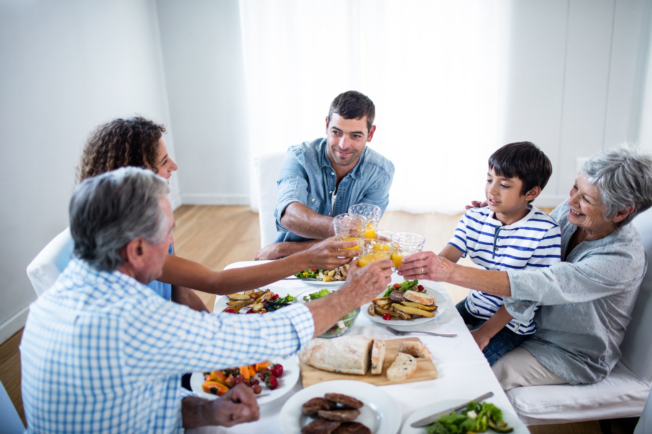 Multiple generations sit around a table.