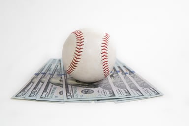 Baseball on top of money