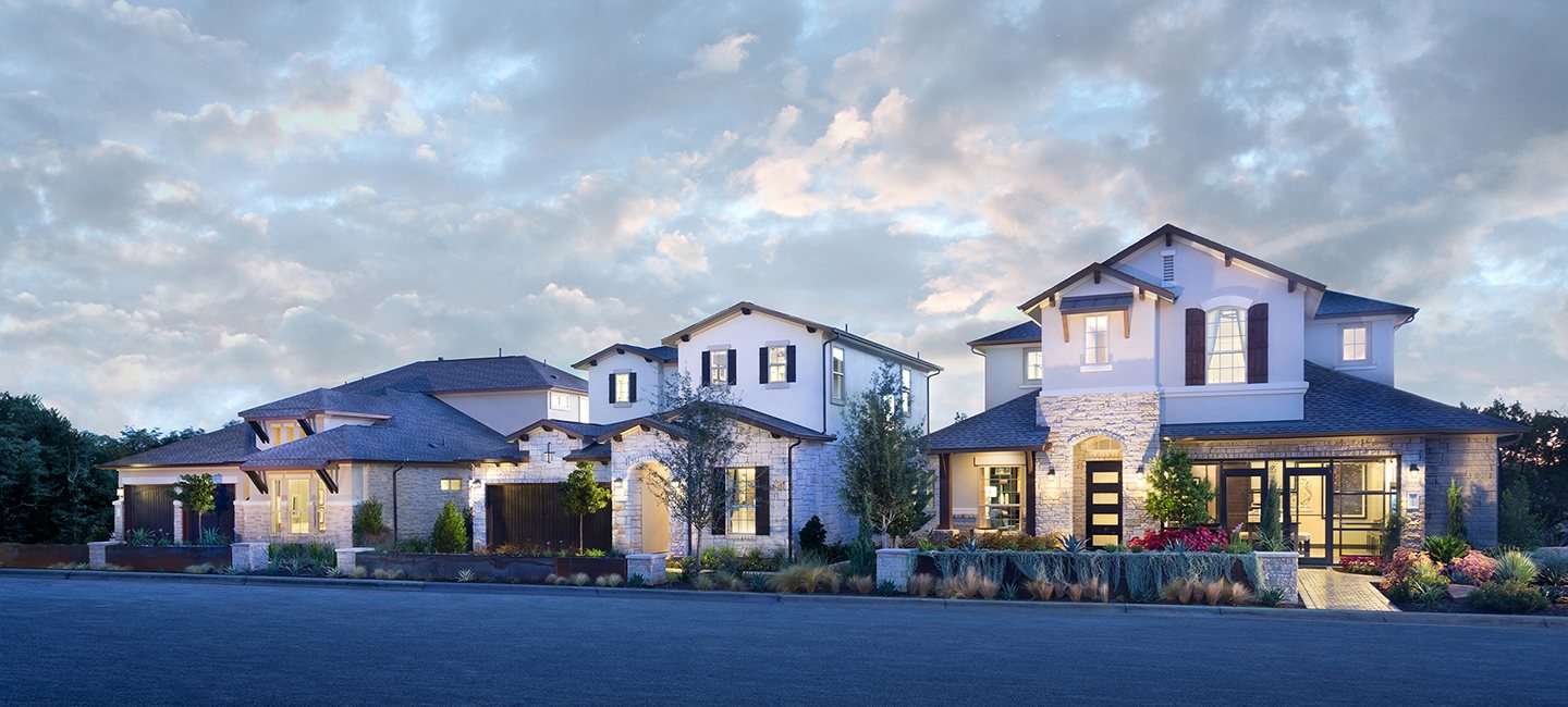 Two Lennar model homes lit up side by side