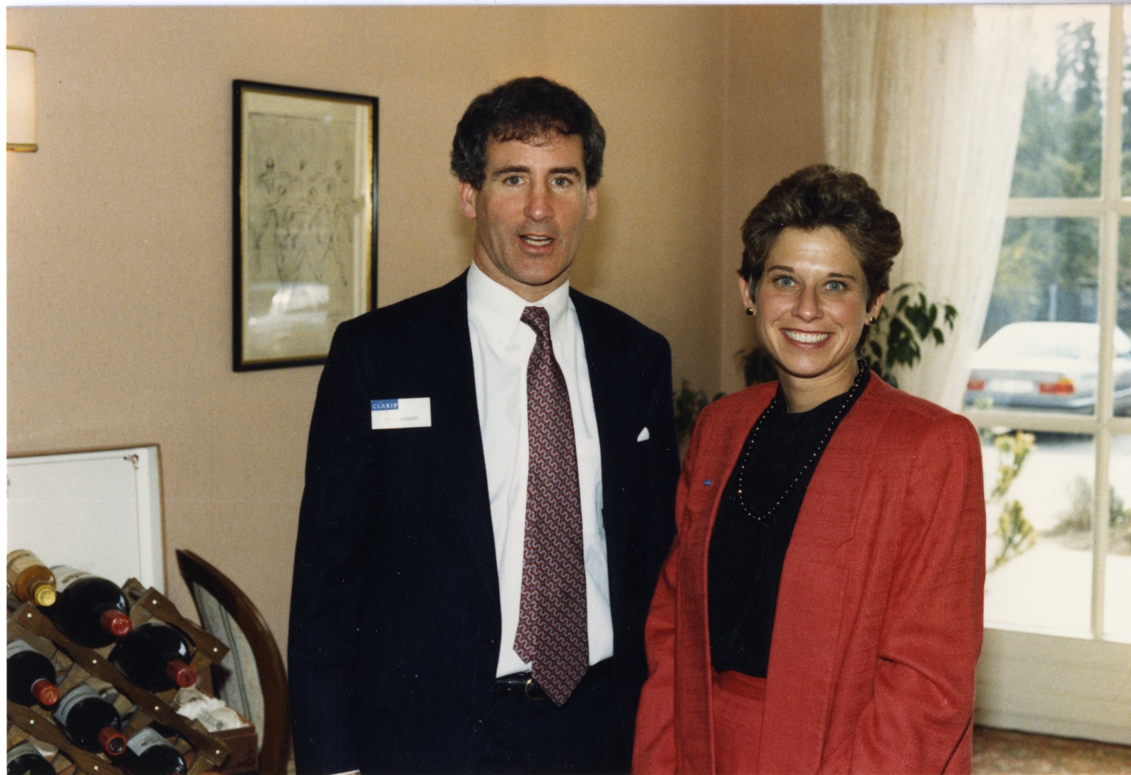 Bill Campbell and Donna Dubinsky standing together, posing for a photo, when both were still at Apple.