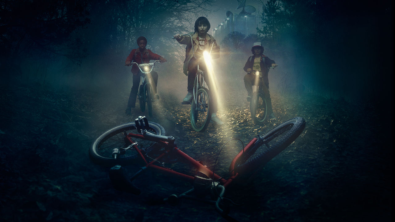 Stranger Things cover art with three friends finding a friend's abandoned bike.