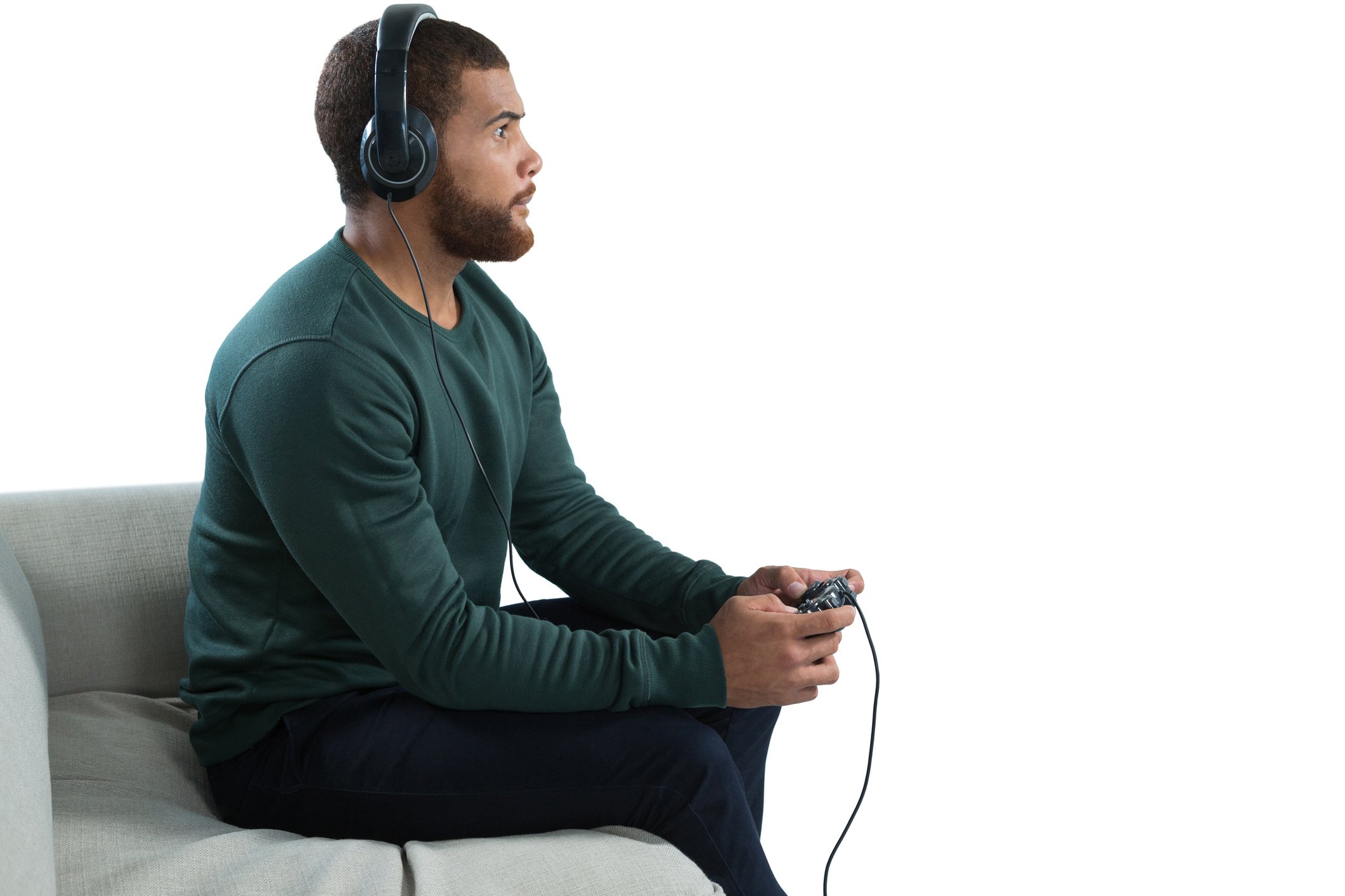 Gamer equipped with a console controller and a gaming headset.