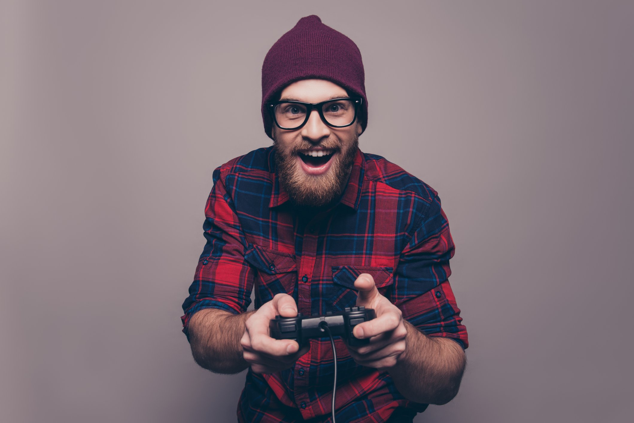 Bearded guy holding videogame controller