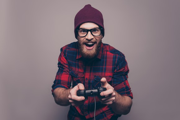 Bearded guy holding videogame controller