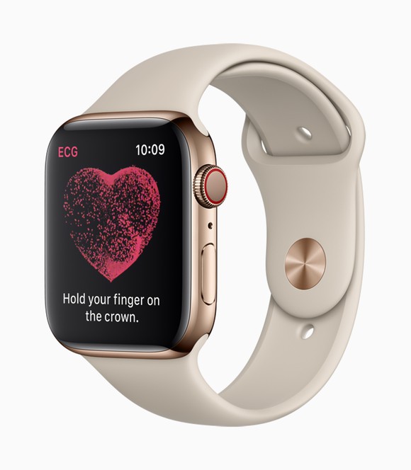 An Apple Watch displaying a heart icon and instructing the wearer to hold their finger on the crown.