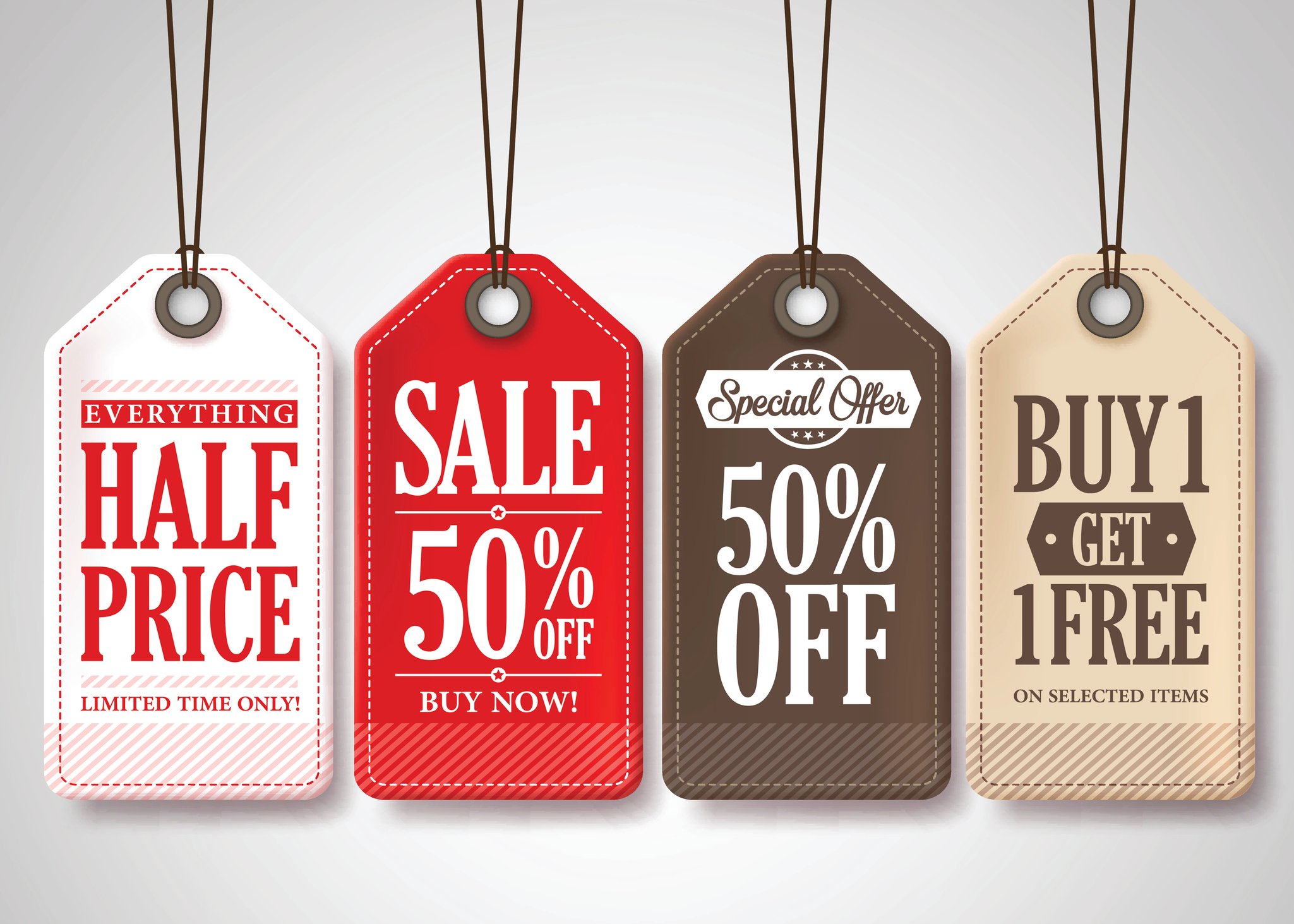 Multicolored sales tags hanging on strings.