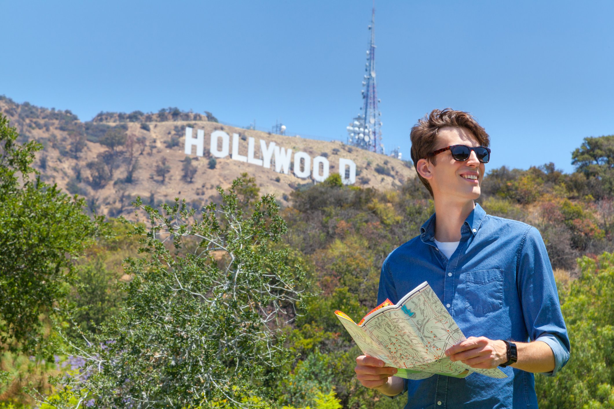 Tourist with the Hollywood sign in the background
