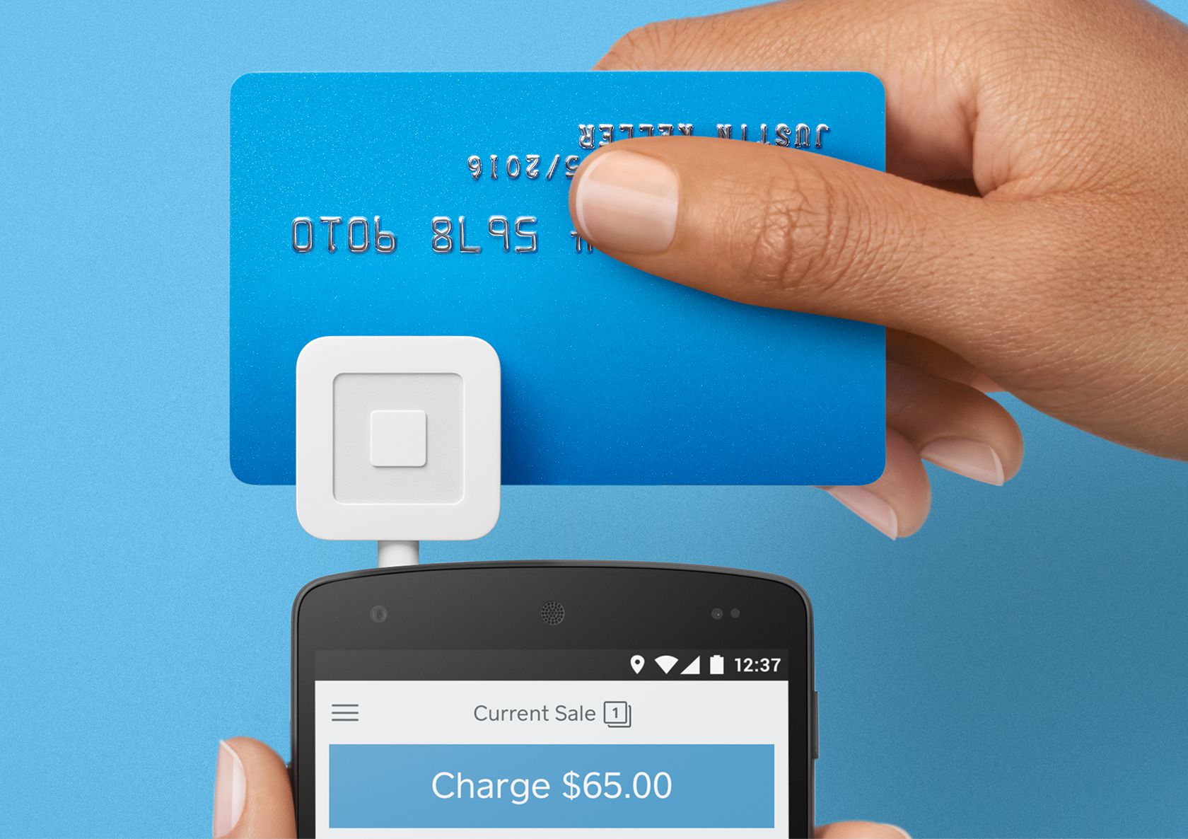 Card being swiped through Square reader