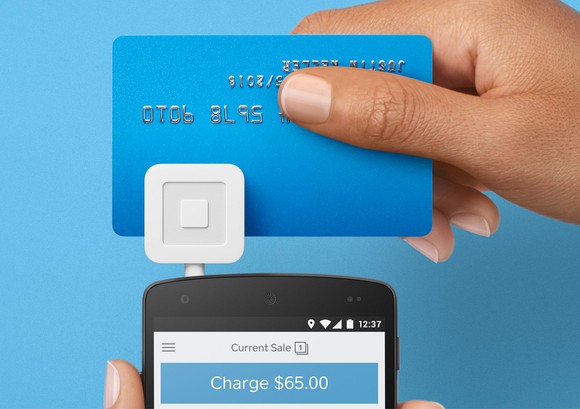 Card being swiped through Square reader