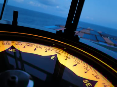 Marine Gyro Compass Above Ocean Freighter