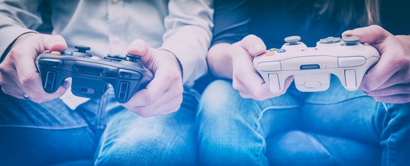 Two gamers play a video game.