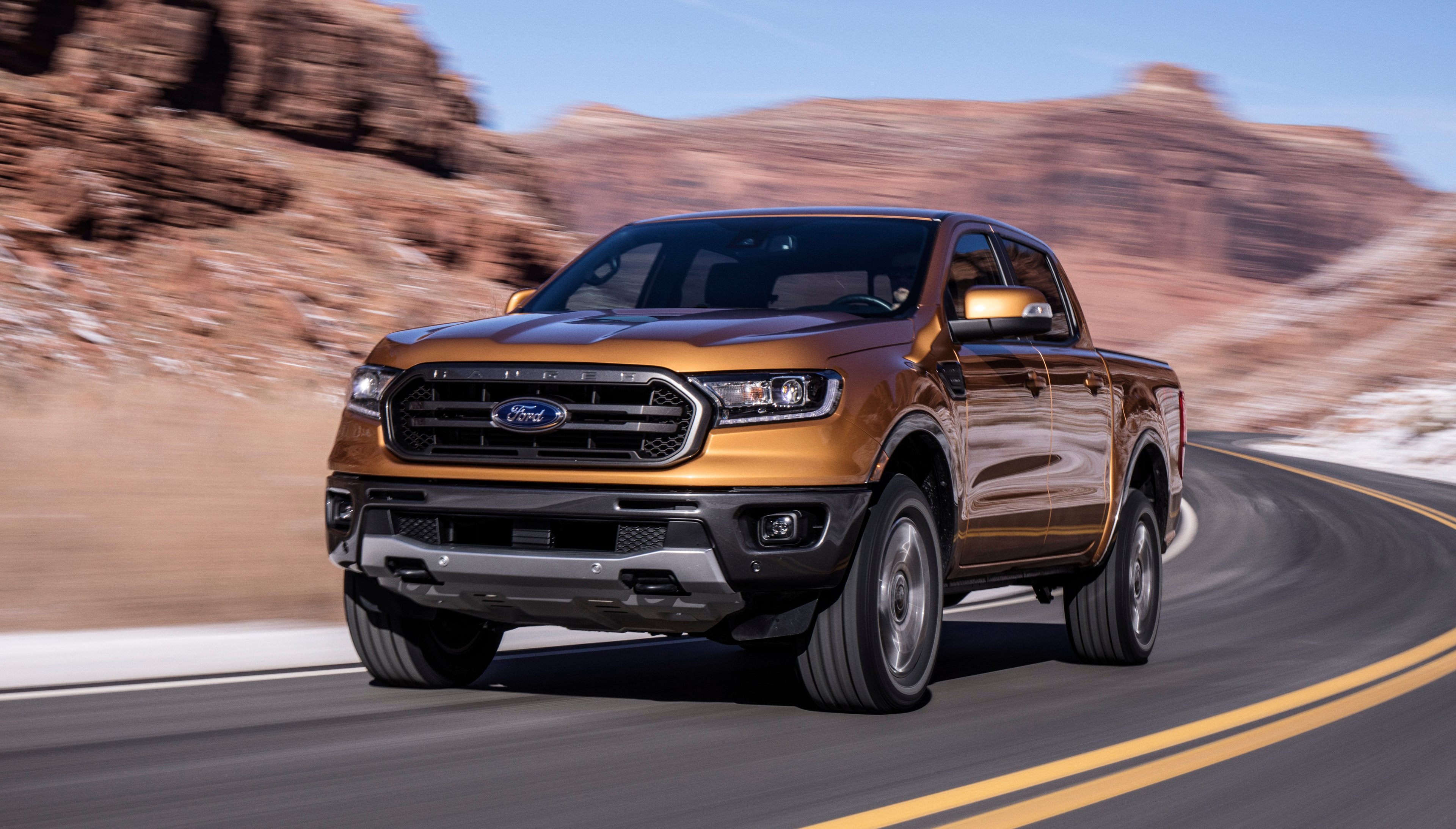 An orange 2019 Ford Ranger, a midsize pickup truck