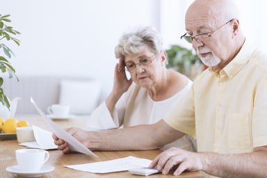 senior couple paperwork_GettyImages-939741200