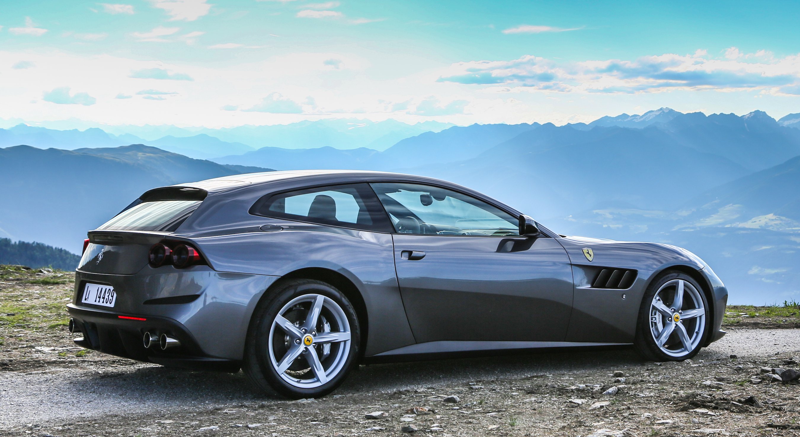 A silver Ferrari GTC4Lusso, a four-passenger luxury-sports car powered by a V12 engine. 