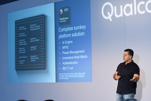A Qualcomm employee presenting a slide about a Qualcomm mobile chip.