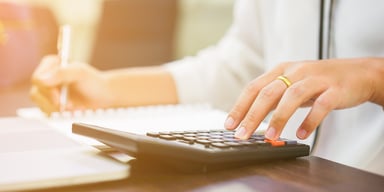 woman with calcuator_GettyImages-1013823236